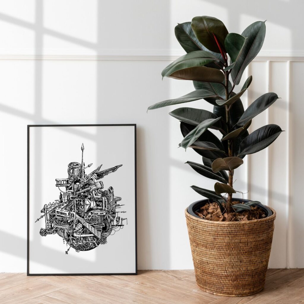 Art poster "charged" leaning against a white wall on the floor, next to a large potted plant, creating a bright and airy corner with an industrial art touch.