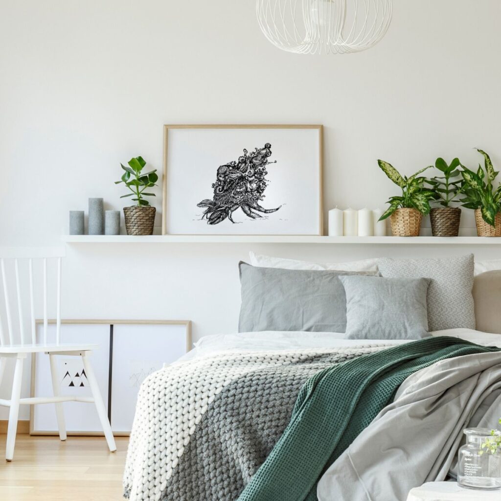 "coming home" poster in a wooden frame styled on a shelf above a bed, adding summer vibes and a holiday feel to a cozy, neutral-toned bedroom.